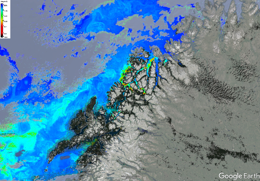 A satellite image from Google Earth showing a mountainous coastal region with varying colors indicating different data points.