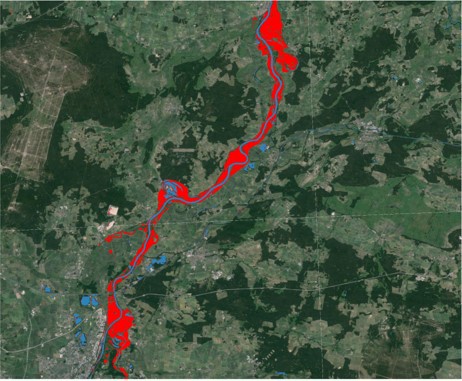 Satellite image showing a river flowing through a landscape with red areas indicating flood zones.
